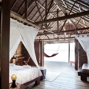 Kri Eco Resort bedroom | Infinite Blue Dive Travel